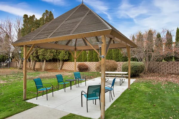 Outdoor covered seating area with chairs