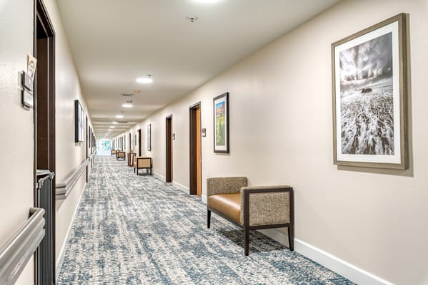 Bright hallway with seating and artwork