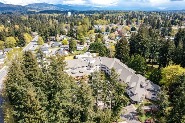 Aerial view of the Renton Assisted Living facility surrounded by trees