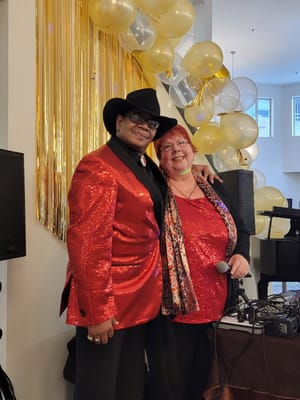 Two performers at a senior living celebration event