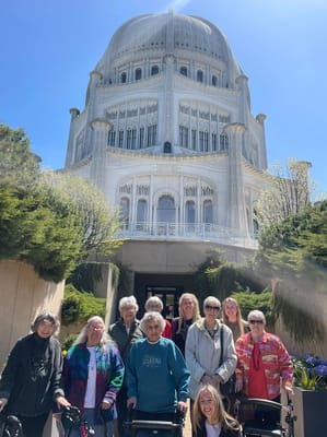 Group of residents outside a beautiful building