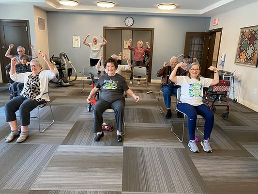 Residents engaging in exercise activity in a communal space