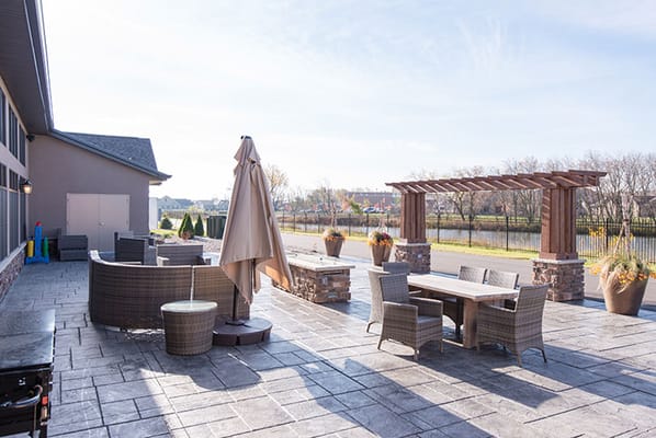 Outdoor patio area with furniture and umbrellas