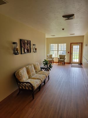 Interior hallway with seating area and natural light
