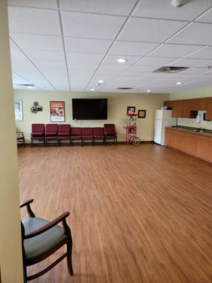 Bright common area with seating and kitchen space