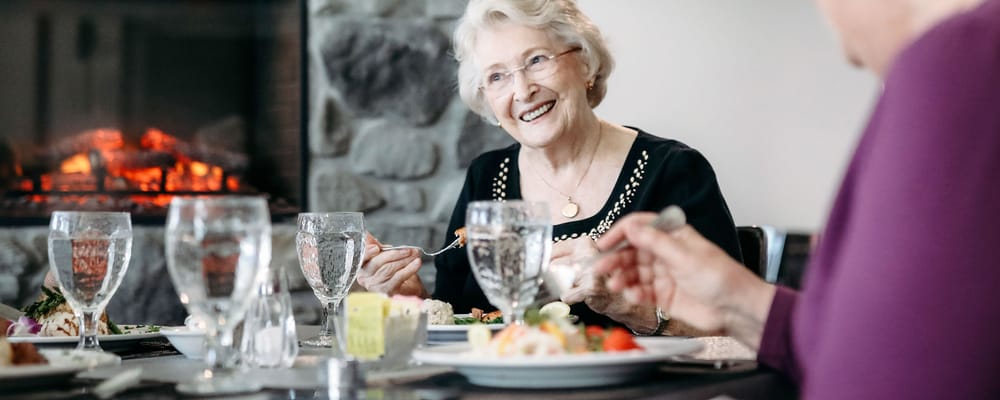 Residents enjoying a meal in the dining room