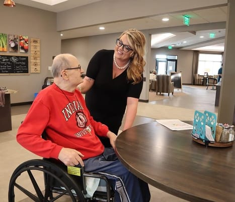 Staff member interacting with a resident in a common area