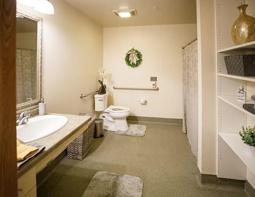 Well-lit bathroom with modern fixtures and decorations