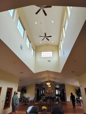 Interior view of a spacious common area with residents