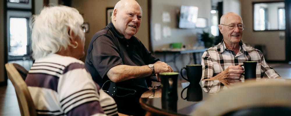 Residents enjoying coffee in a common area