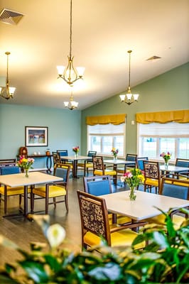 Bright dining area with tables and flower arrangements