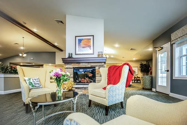 Cozy common area with seating and a fireplace