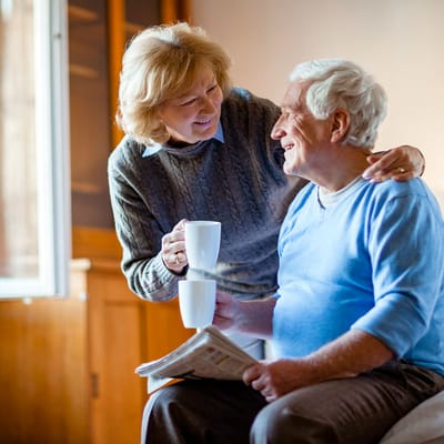 A caregiver sharing a smile with a resident