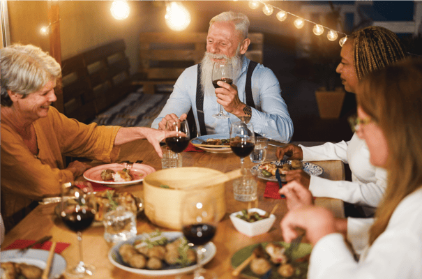 Residents enjoying a meal together at a dining table