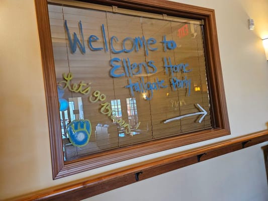 Welcome sign for a tailgate party with decorations