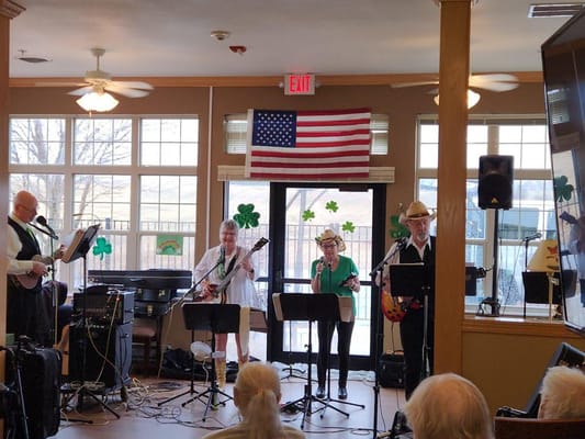 Residents enjoying a live music performance in a common area