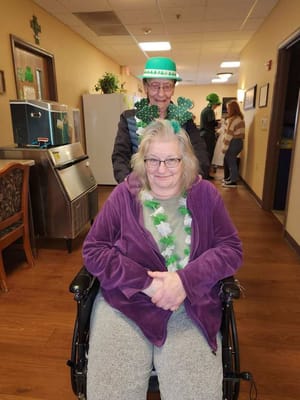 Residents celebrating with festive attire in a hallway