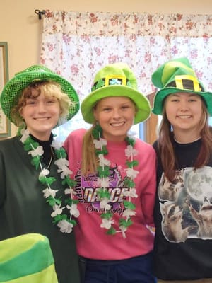 Staff celebrating with festive attire and decorations