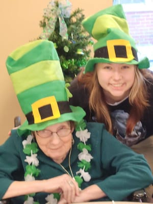 Residents celebrating with festive hats and decorations