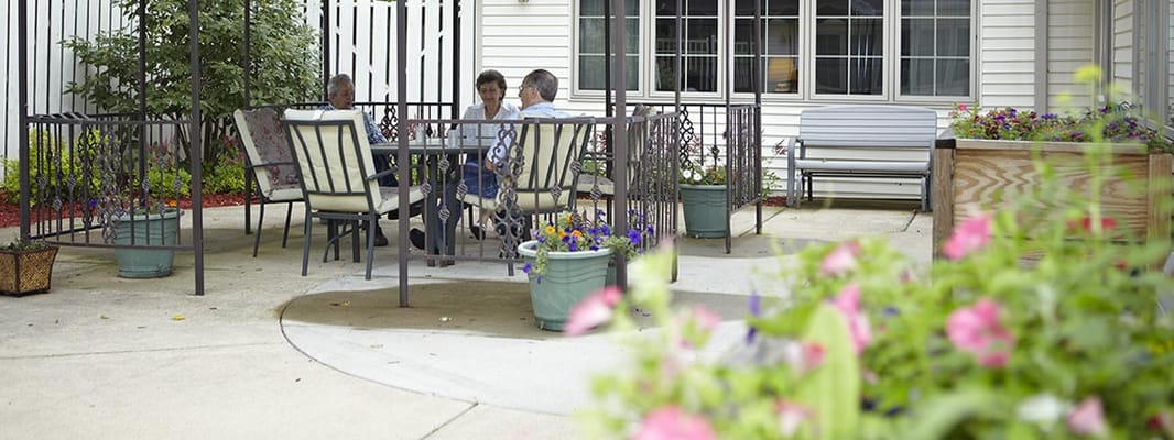 Residents enjoying the outdoor seating area