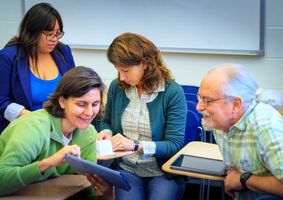 Group of people engaged in an activity in a classroom