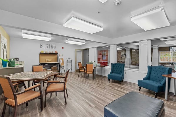 Bright bistro area with seating and tables