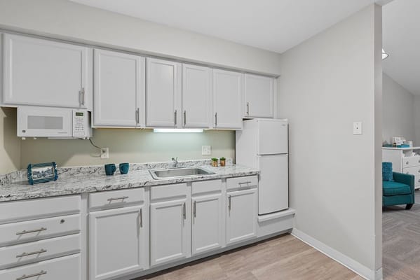 Bright kitchen area in a senior living unit
