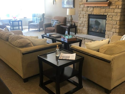Interior common area with seating and fireplace