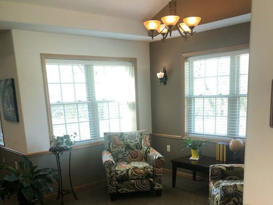 Bright common area with seating and plants