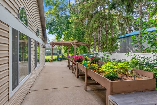 Outdoor garden area with vibrant flower boxes