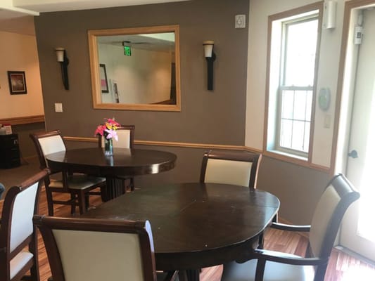 Bright common area with tables and chairs