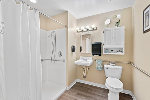 Clean bathroom facility with shower and sink