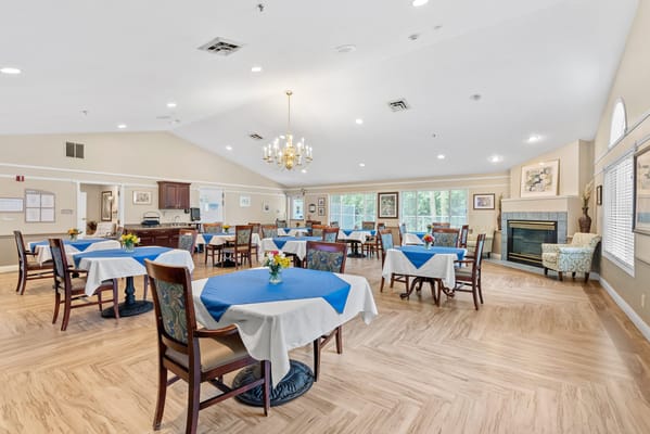 Bright dining room with tables set for a meal