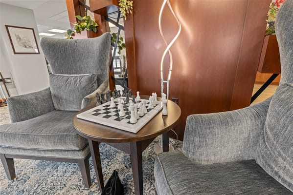 Chessboard on a table in a cozy lounge area