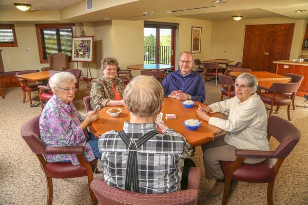 Residents playing cards in a common area