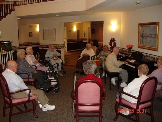 Residents enjoying a music activity in a common area