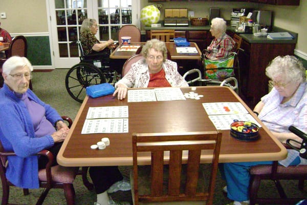 Residents playing bingo in a common area