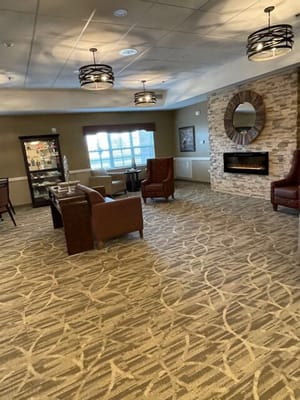 Interior view of a cozy common area with seating