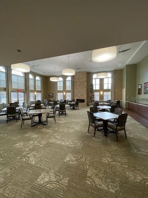 Bright dining area with tables and chairs