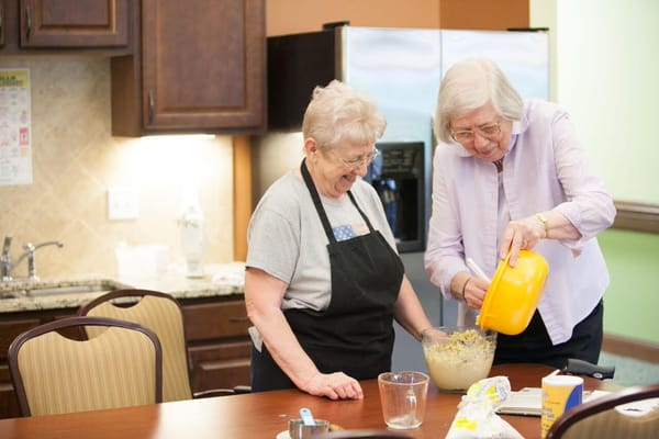 Residents cooking together in the kitchen