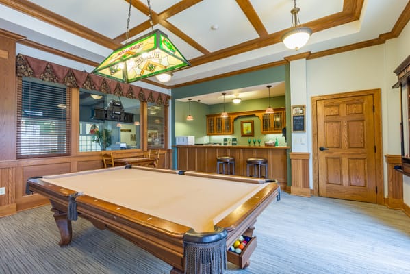 Interior view of a recreational room with a pool table