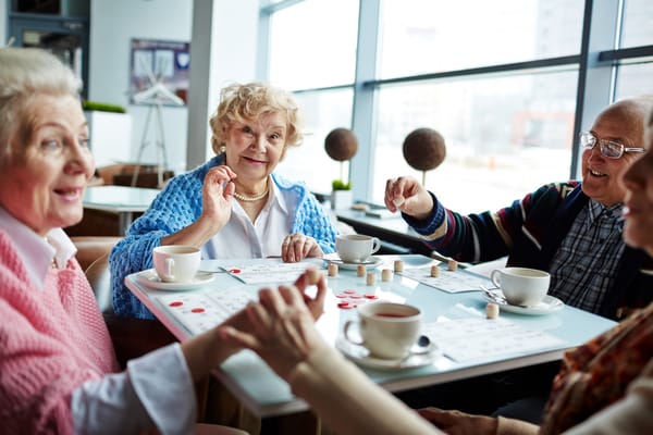 Residents enjoying a game in a common area