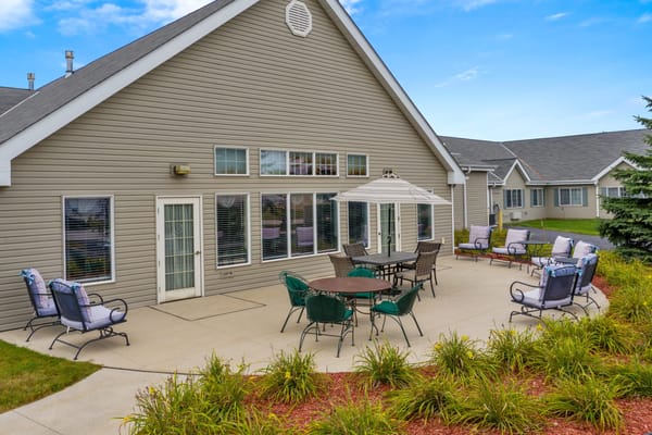 Outdoor patio area with seating for residents