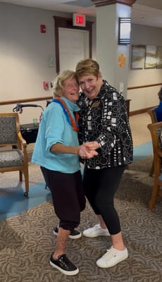 Residents enjoying a dance together in a common area