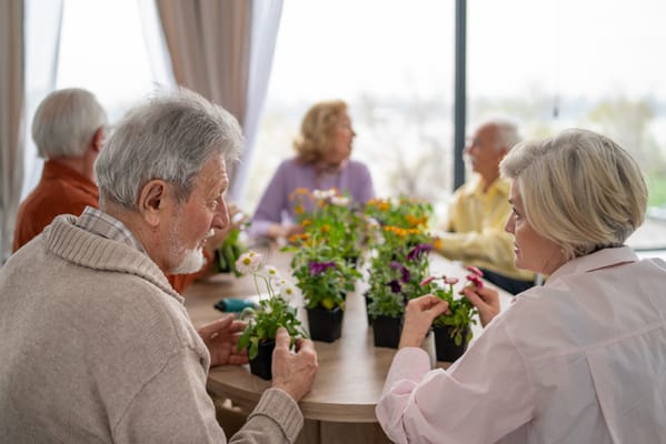 Residents participating in a gardening activity indoors