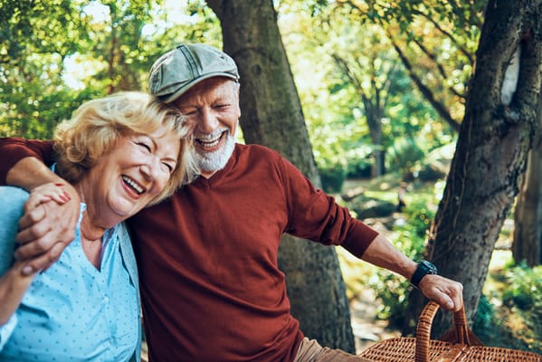 A couple enjoying a sunny day in a garden