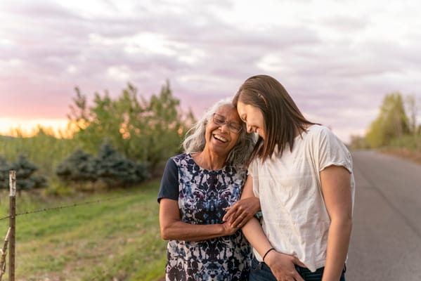 Two women enjoying time outdoors during sunset