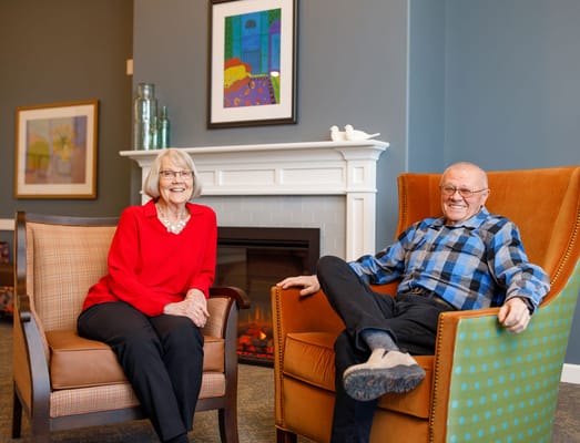 Two residents enjoying a cozy common area