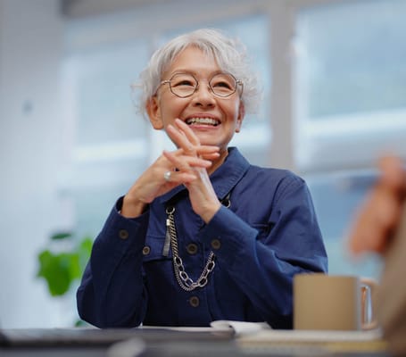Senior resident smiling during a conversation