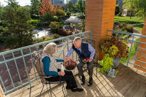 Residents enjoying gardening on a balcony